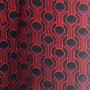 Silk blouse with small slit in top back. Red with navy blue.